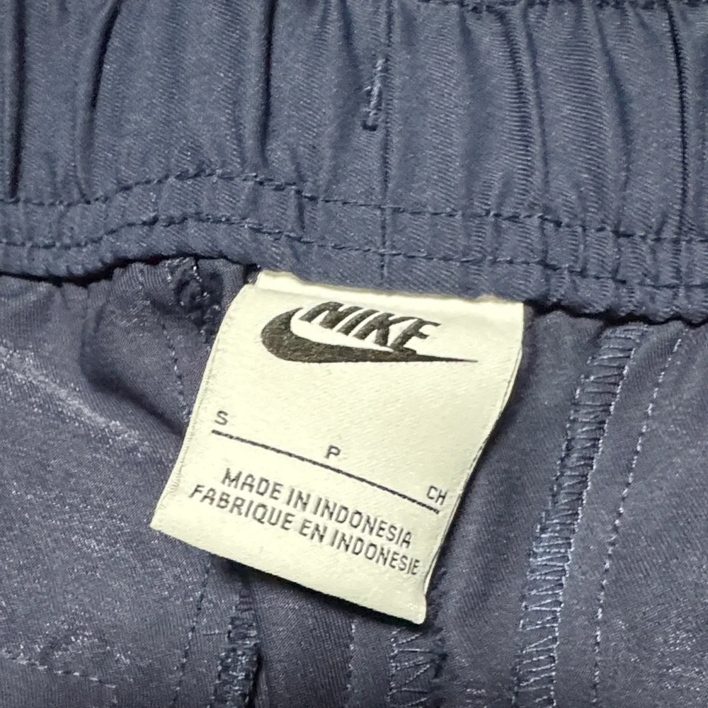 Nike Men's Navy Blue Joggers with White Drawstrings